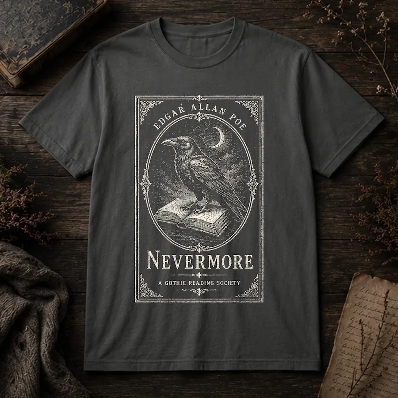 Flat lay of Pepper Comfort Colors 1717 Edgar Allan Poe Nevermore gothic t-shirt showing full raven woodcut design