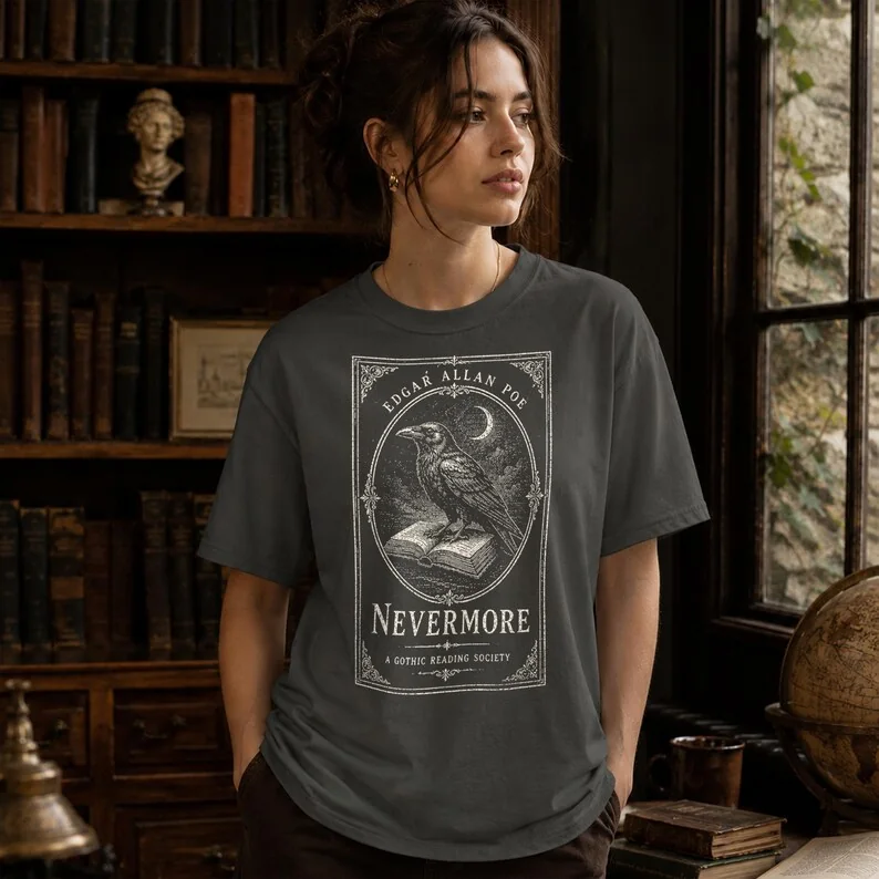 Pepper Comfort Colors Edgar Allan Poe Nevermore t-shirt worn by a woman in a gothic dark academia library setting