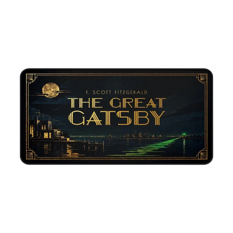 F. Scott Fitzgerald’s The Great Gatsby desk mat featuring the novel’s title as the focus within a symmetrical black-and-gold Art Deco design.