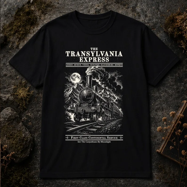 Black Comfort Colors Transylvania Express shirt shown flat with complete Gothic train and Dracula-inspired design visible.